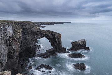 Fototapeta na wymiar Beautiful landscape image of Green Bridge of Wales on Pembrokeshire Coast in Wales