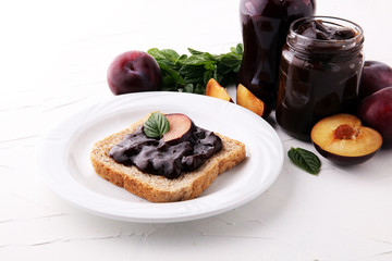 Fresh plum jam with toast or bread for breakfast