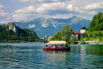 Colorful summer scene on the Bled lake with medieval castle Blejski grad. Slovenia, Europe.