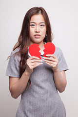 Beautiful young Asian woman with broken heart.