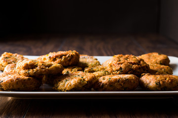 Fried Chickpeas Falafel on wooden surface.