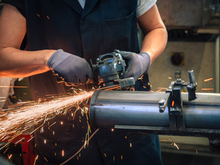 Use of angular grinder in a factory.