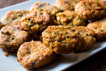 Fried Chickpeas Falafel on wooden surface.