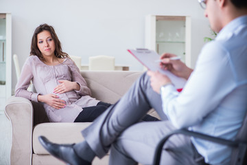 Pregnant woman visiting psychologist doctor