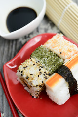 Sushi and soy sauce on the rustic table 