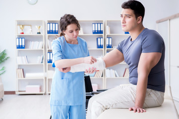 Doctor and patient during check-up for injury in hospital