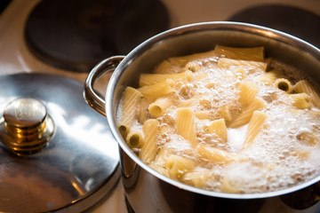 Cooking pasta in pot on stove pot