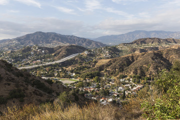 Afternoon view of Glendale hills homes and freeway near Los Angeles in Southern California.