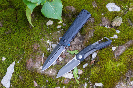 Two folding knives. Knives with different handles.