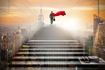 Businessman superhero successful in career ladder concept