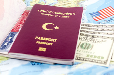 Turkish Passport and USA Visa on map of USA