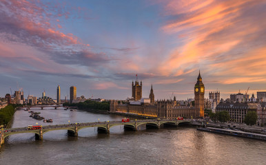 Fototapeta na wymiar Westminster Bridge and Houses of Parliament with a spectacular sunset in the background
