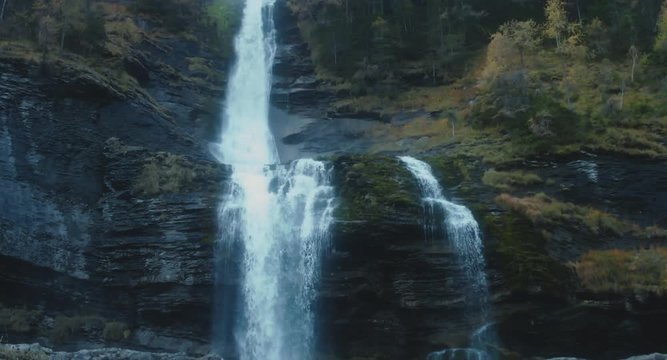 TILT DOWN shot of Cascade du Rouget waterfall in November, French Alps. 4K UHD RAW 60 FPS SLO MO