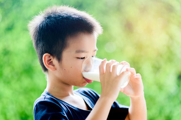 Young boy drinking milk