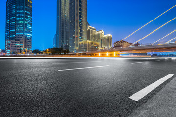 Fototapeta na wymiar Empty asphalt road through modern city in Tianjin, China.