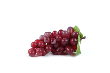 Ripe red grape. Pink bunch with leaves isolated on white. With clipping path. Full depth of field.