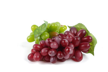 Ripe red grape. Pink bunch with leaves isolated on white. With clipping path. Full depth of field.