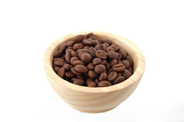 coffee seeds in Wooden bowl Isolated on white background.