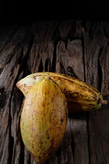 Cacao fruit, raw cacao beans, Cocoa pod on wood background