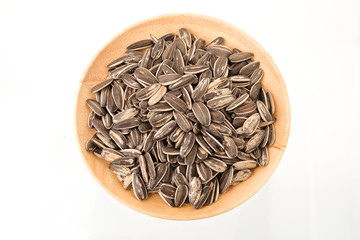 Sun flower seed  in wood bowl on white background
