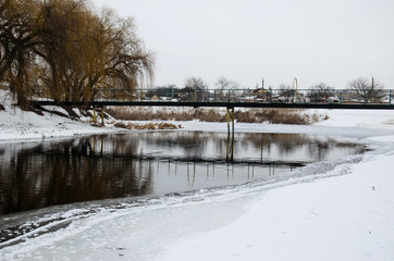 Footbridge across the frozen river