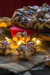 Star shaped cookies on wooden board. Christmas baking.