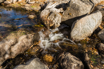 Water from the Perales River, in the mountains of Madrid, eroding the granite rocks