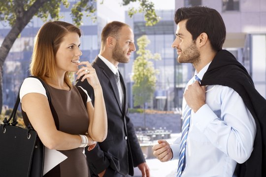Attractive businesswoman flirting with colleague