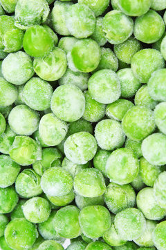 Frozen pea peases texture background. Green pease background pattern. Green peas.