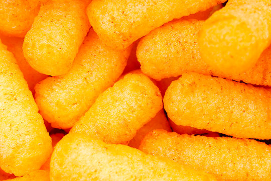 Cheese puff. Cheese puffs snack background texture food pattern. Pattern.