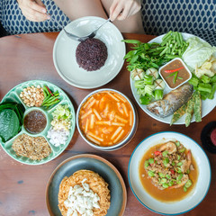 Young people eating in a Thai restaurant