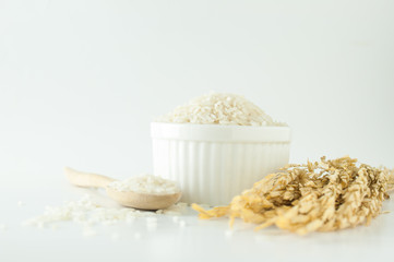 Close up rice in white bowl with wheat on isolated white background