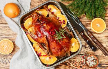 Festive duck baked with oranges, cranberries, rosemary and spices. New year. Christmas. Selective focus