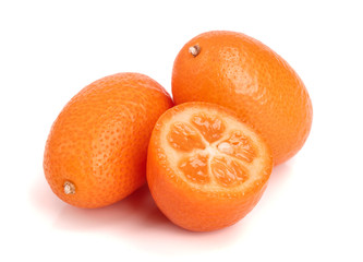 Cumquat or kumquat with half isolated on white background close up