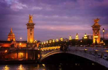 Fototapeta na wymiar famouse Alexandre III Bridge at violet night, Paris, France, retro toned
