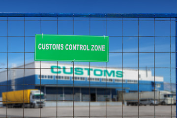 Customs control area with lorries near warehouse logistics center.