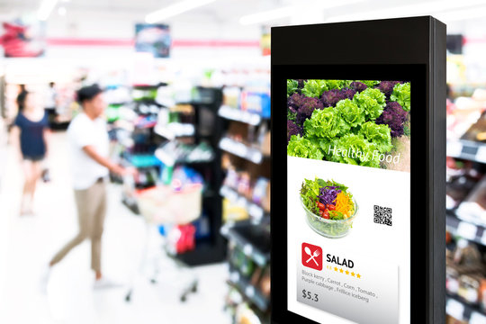 Intelligent Digital Signage , Augmented reality marketing and face recognition concept. Interactive artificial intelligence digital advertisement in retail hypermarket Mall.