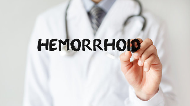 Doctor writing word Hemorrhoid with marker, Medical concept
