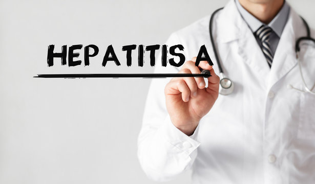 Doctor writing word Hepatitis A with marker, Medical concept