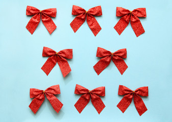 Red bow pattern on blue background.