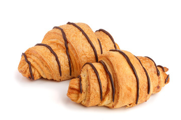 croissant decorated with chocolate sauce isolated on white background, top view