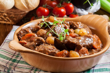 Beef Bourguignon stew served with baguette