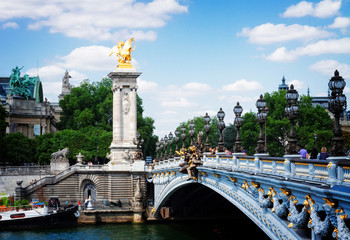 Fototapeta na wymiar arch of Bridge of Alexandre III over river Seine at summer day, France, retro toned