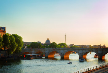 bridge Pont Neuf and Seine river at sunny summer sunset, Paris, France, retro toned