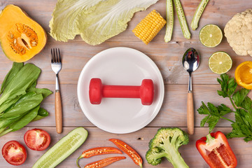 Food and sheet of paper with a diet plan on a dark wooden table. Concept of diet and healthy lifestyle.
