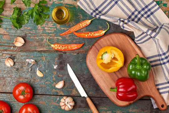 Include fresh organic vegetables and wood cutting board on wooden floor with copy space still life