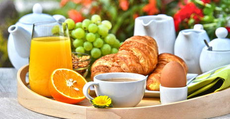 Breakfast served with coffee, juice, croissants and fruits