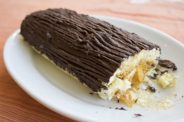 yule log cake covered with chocolate