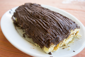 yule log cake covered with chocolate