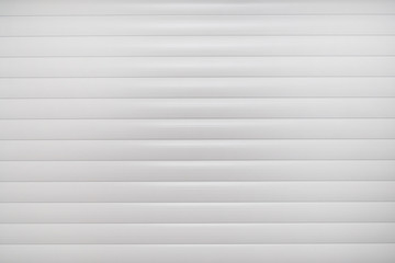 Aluminum white industrial roller shutters background.